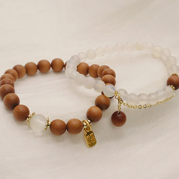Bransoletka ochronna z Buddha Stones, sandałowym drzewem i kocim okiem Fu Character Charm
