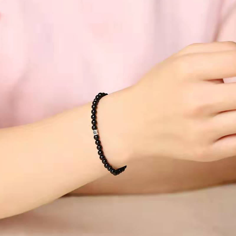 Bransoletka oczyszczająca z Buddha Stones , naturalnego czarnego obsydianu i kwarcu dymnego