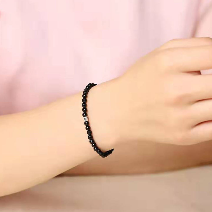 Bransoletka oczyszczająca z Buddha Stones , naturalnego czarnego obsydianu i kwarcu dymnego