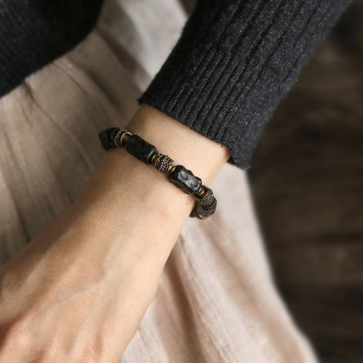 Bransoletka Buddha Stones Tybetański Heban Drewno Miedź Spokój Spokój