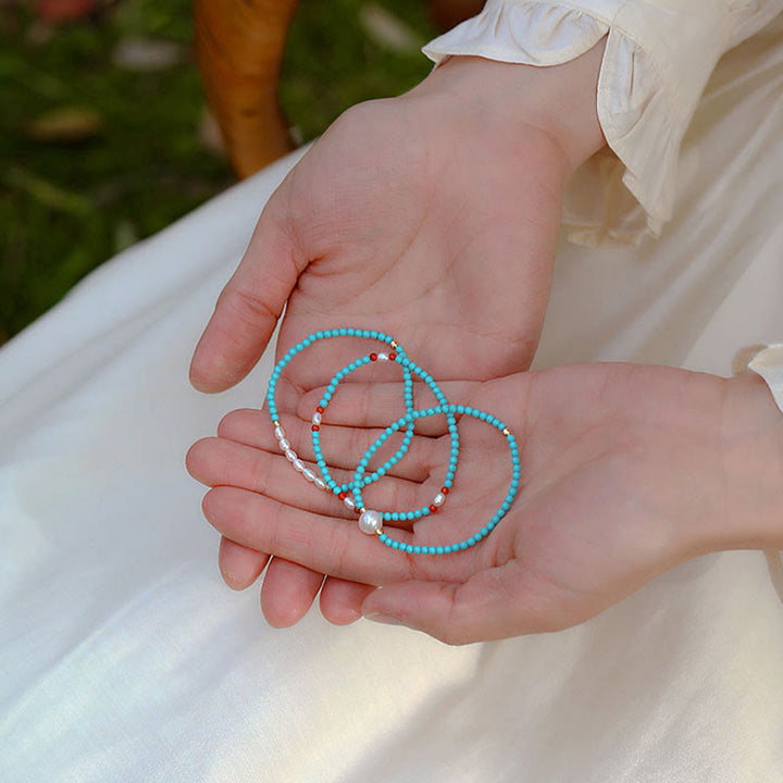 Bransoletka ochronna z małych koralików z Buddha Stones i czerwonego agatu