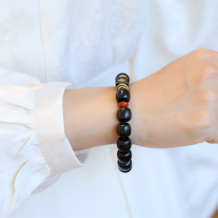 Bransoletka Buddha Stones Ebony Drewno Pomyślne Chmury Grawerowane Spokojne