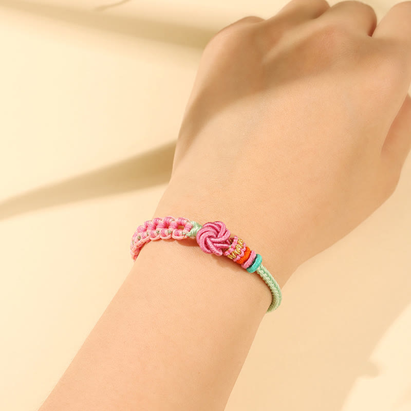 Bransoletka Buddha Stones w kolorze różowo-zielonym z brzoskwiniowym kwiatem, ręcznie pleciona