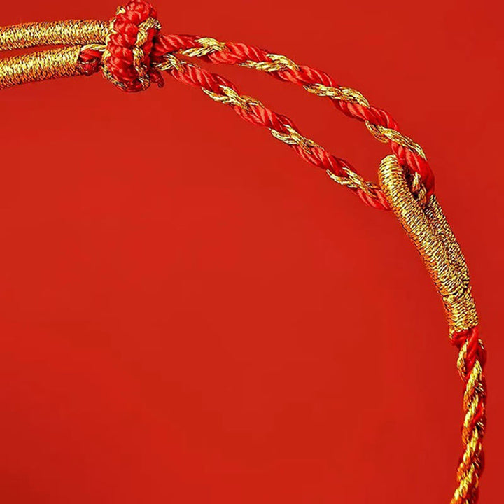 Bransoletka szczęścia z czerwonych sznurków i żółtego sznurka z Buddha Stones