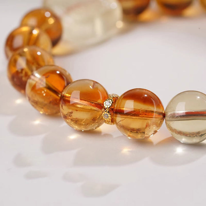 Bransoletka Buddha Stones Topaz Zashi Lhamo Kindness