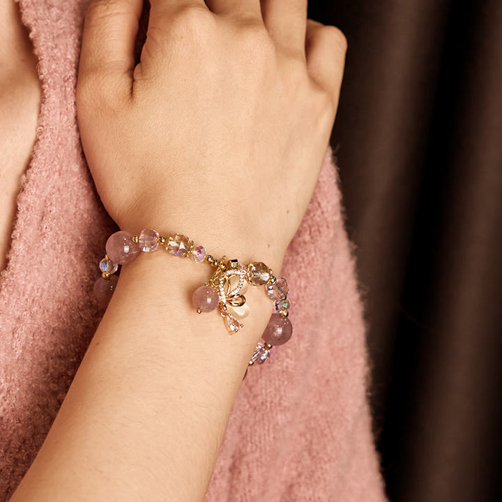 Bransoletka lecznicza z naturalnego kwarcu truskawkowego i motyla z Buddha Stones