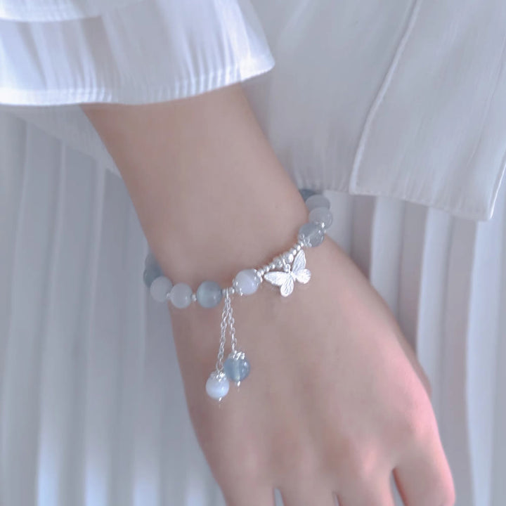 Bransoletka wspierająca z Buddha Stones, motylem i akwamarynem w kształcie kociego oka