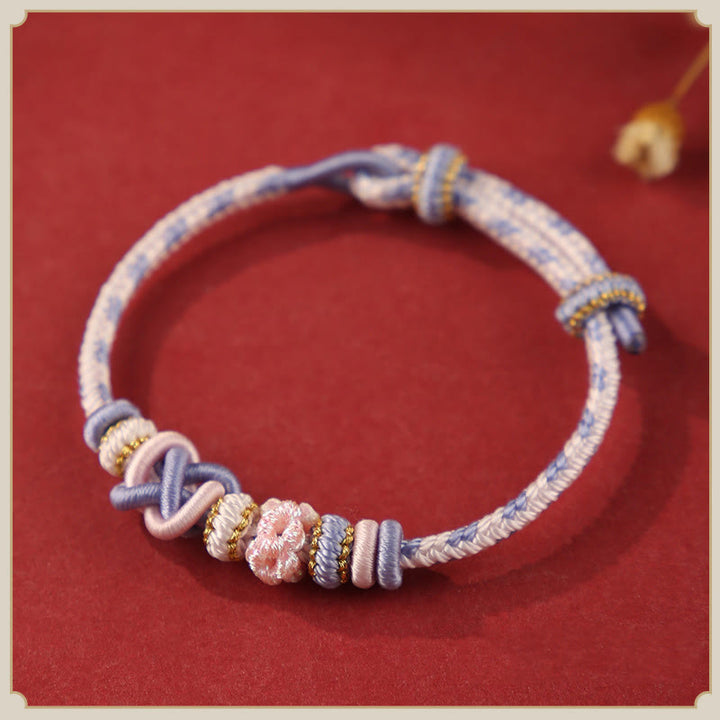 Buddha Stones ręcznie robione brzoskwiniowe kwiaty węzeł pokoju kolorowa lina regulowana bransoletka