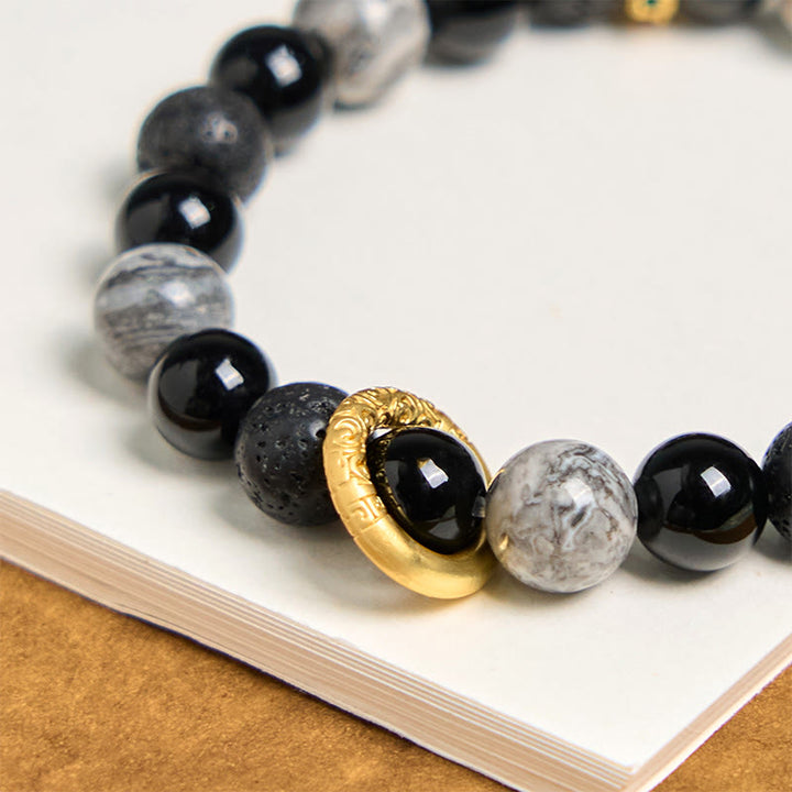 Bransoletka lecznicza z Buddha Stones , lawą i czarnym onyksem Picasso Jasper