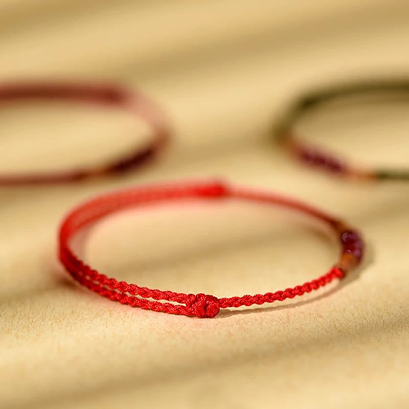 Bransoletka z Buddha Stones , koralików z cynobru, drewna brzoskwiniowego, sznurka błogosławieństwa