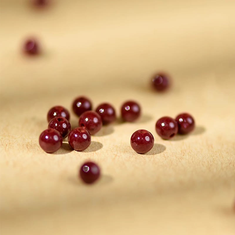 Bransoletka z Buddha Stones , koralików z cynobru, drewna brzoskwiniowego, sznurka błogosławieństwa