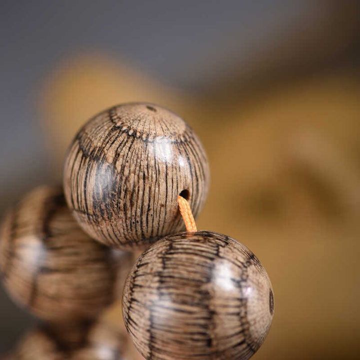 Bransoletka ochronna z koralików z drewna Gnetum z Buddha Stones - image 11