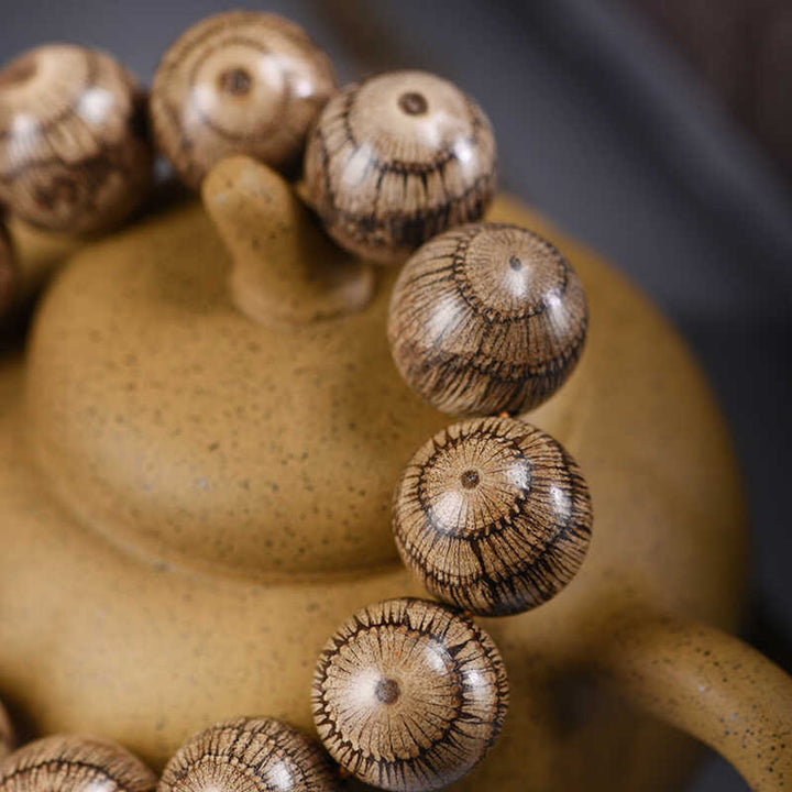 Bransoletka ochronna z koralików z drewna Gnetum z Buddha Stones - image 3