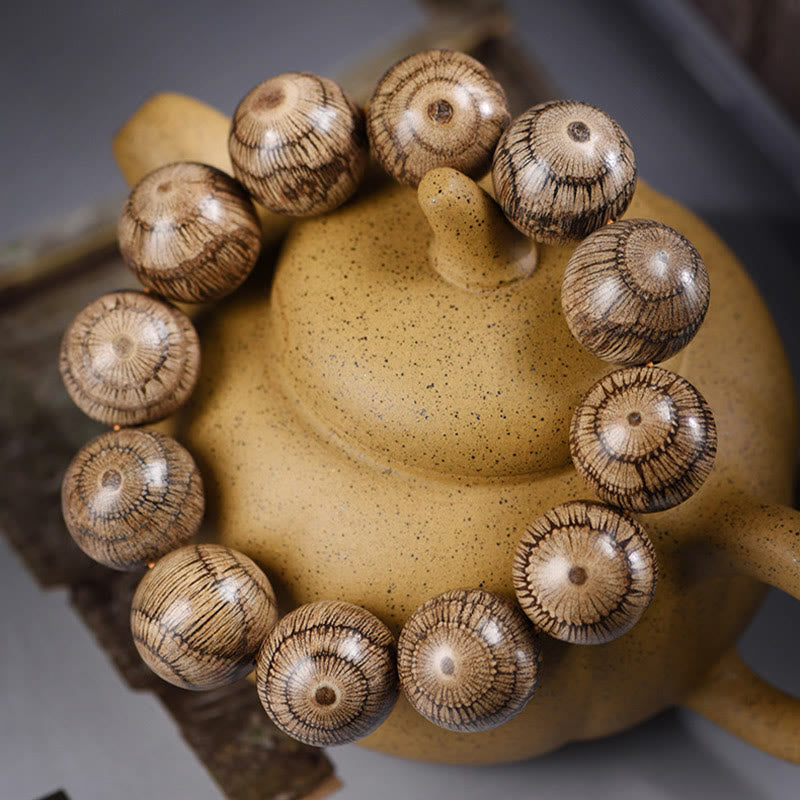 Bransoletka ochronna z koralików z drewna Gnetum z Buddha Stones - image 2