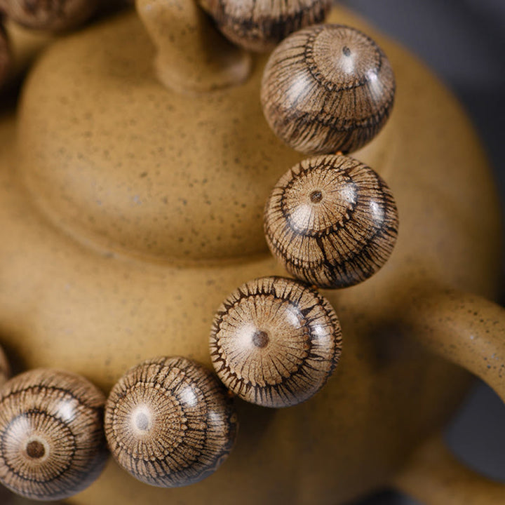 Bransoletka ochronna z koralików z drewna Gnetum z Buddha Stones - image 4