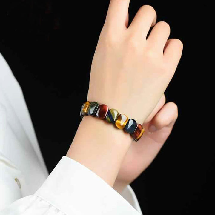 Bransoletka wzmacniająca z naturalnych kolorowych owalnych koralików z Buddha Stones i tygrysiego oka