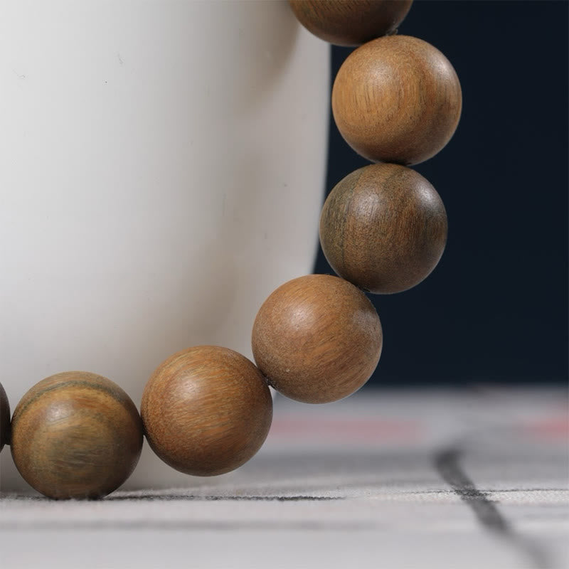 Bransoletka PiXiu z zielonymi Buddha Stones i sandałowcem, która przyciąga bogactwo - image 12