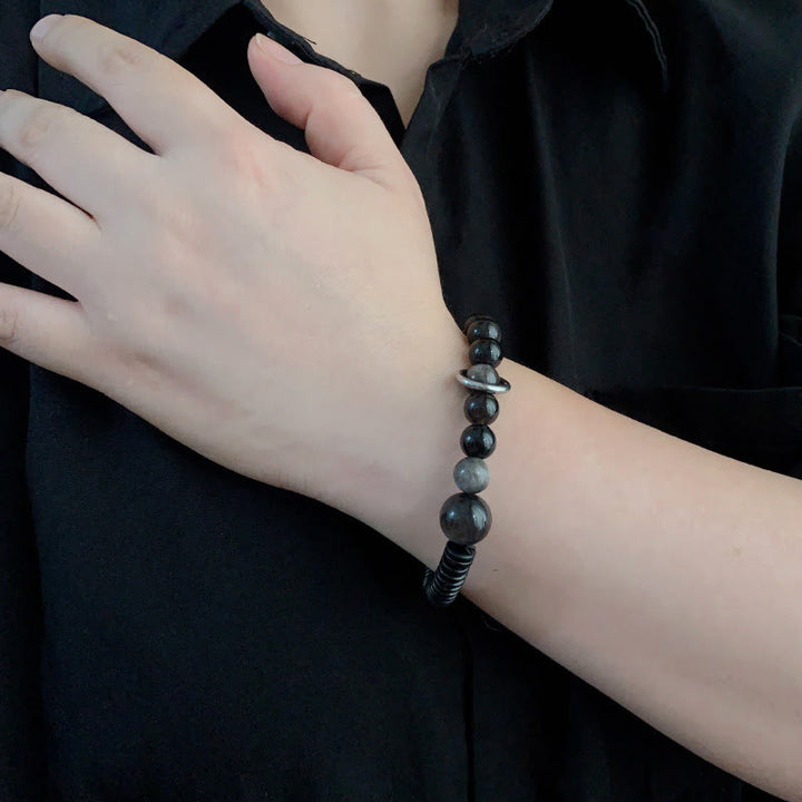 Bransoletka ochronna z obsydianu i skorupy kokosa z Buddha Stones w srebrnym połysku - image 10