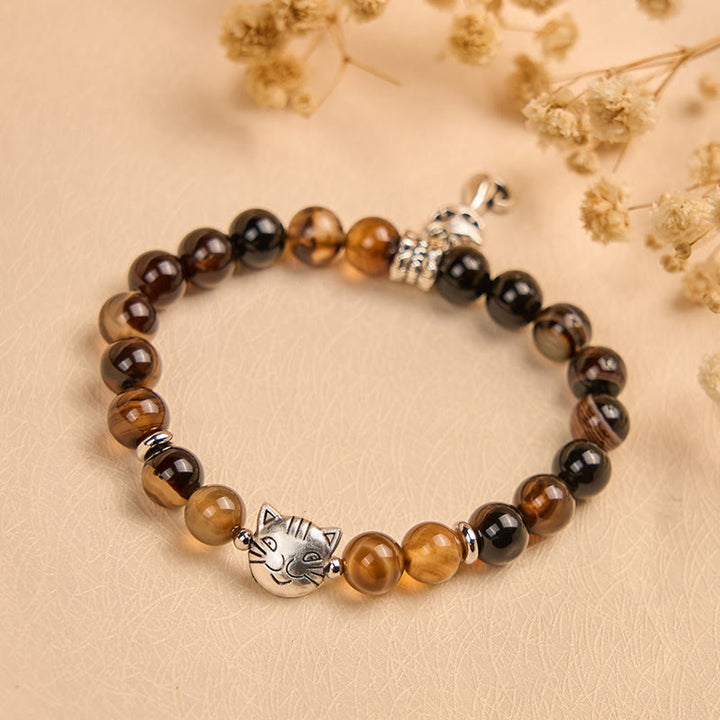 Bransoletka ochronna z koralików agatu w kolorze czekoladowym i ciemnobrązowym z motywem kota syjamskiego - image 1