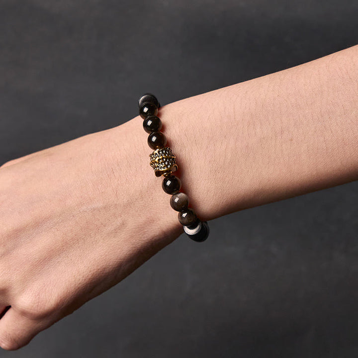 Bransoletka ochronna z obsydianu i hebanu z połyskiem srebrnym i Buddha Stones - image 4