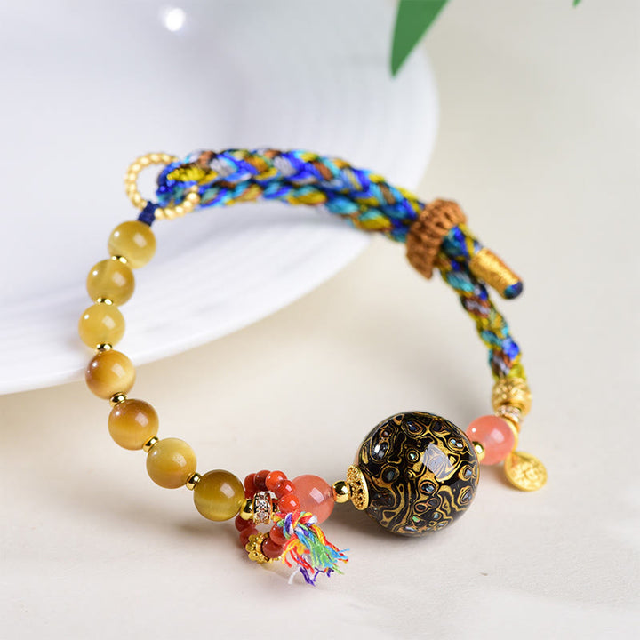 Bransoletka ochronna z kamieniami Buddha Stones z tybetańskich koralików lakierowanych, tkana ręcznie - image 3