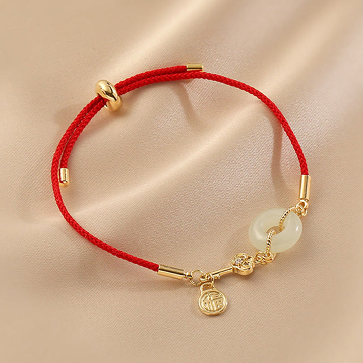 Buddha Stones 18K pozłacane Hetian Jade Peace Buckle Fu Character Luck Red Rope Bracelet
