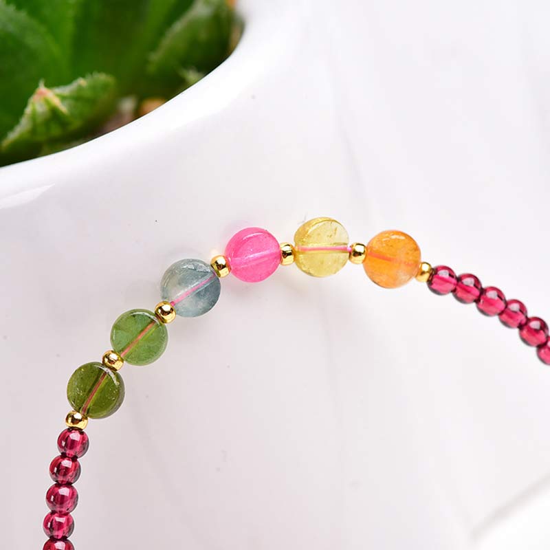 Bransoletka ochronna z turmalinem granatowym i motylem