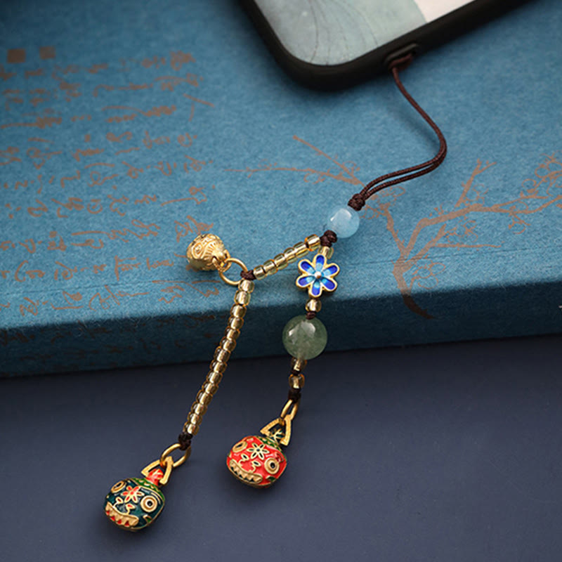 Złoty breloczek do kluczy z motywem rodzinnego szczęścia bestii połykającej złoto