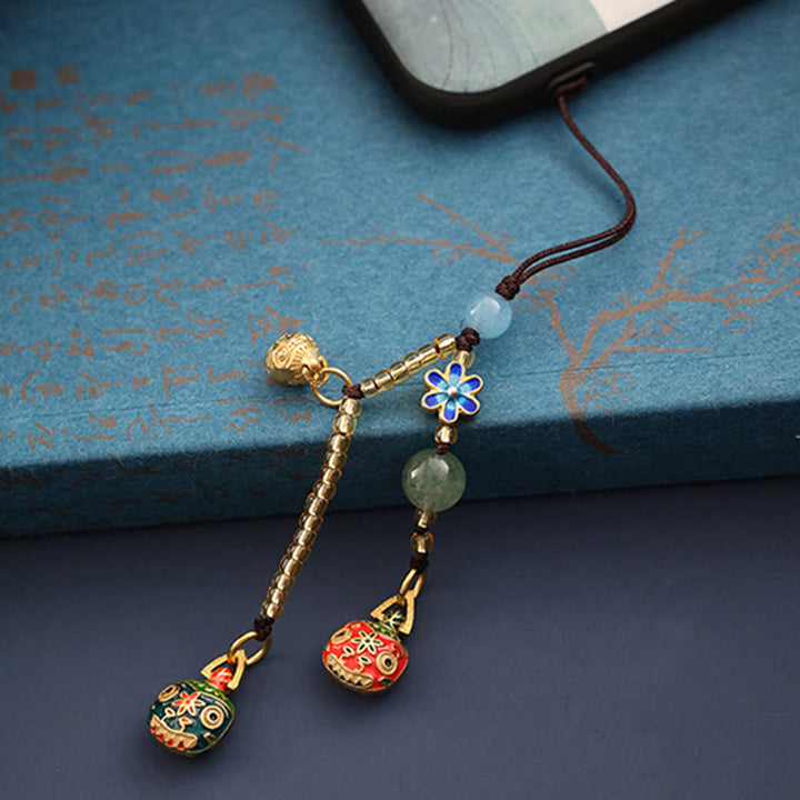 Złoty breloczek do kluczy z motywem rodzinnego szczęścia bestii połykającej złoto