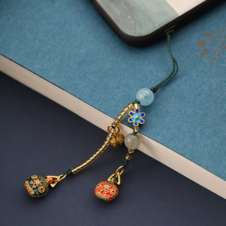 Złoty breloczek do kluczy z motywem rodzinnego szczęścia bestii połykającej złoto