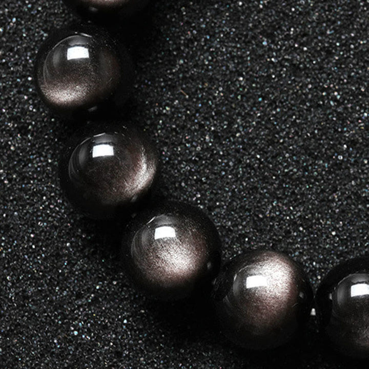 Bransoletka ochronna z naturalnego obsydianu i Buddha Stones w kolorze srebra