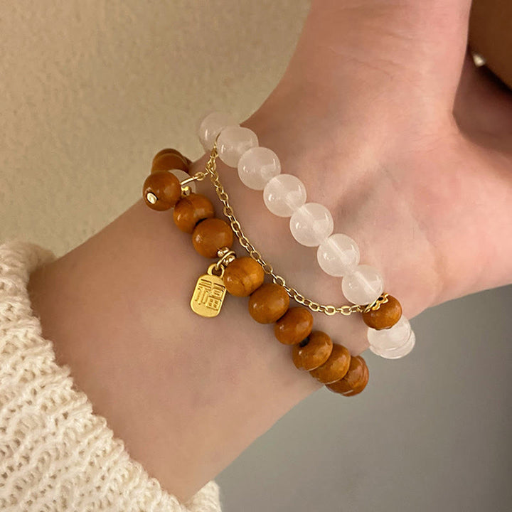 Bransoletka ochronna z Buddha Stones, sandałowym drzewem i kocim okiem Fu Character Charm