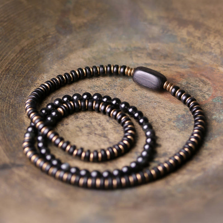 Bransoletka lecznicza z Buddha Stones, tęczowym obsydianem, drewnem hebanowym i miedzią, potrójnie owinięta
