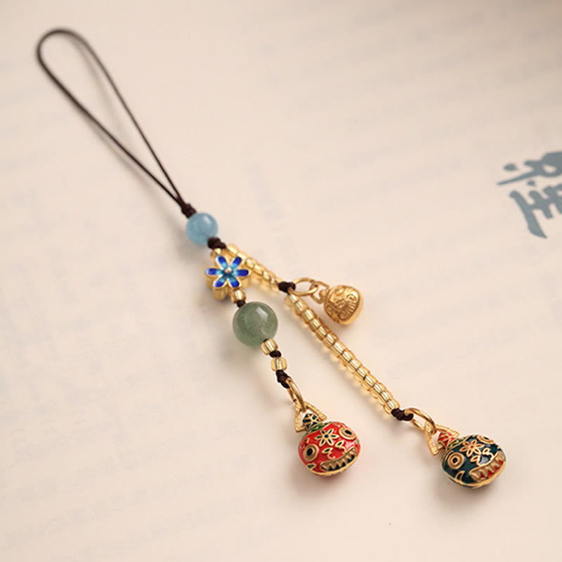 Złoty breloczek do kluczy z motywem rodzinnego szczęścia bestii połykającej złoto