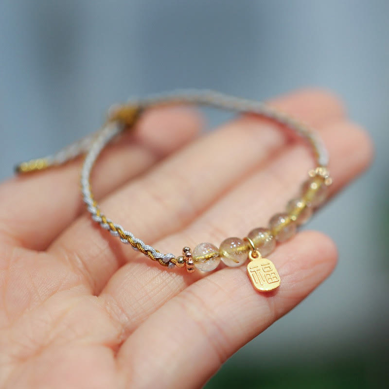 Bransoletka warkoczowa z naturalnego jadeitu i kwarcu rutylowego Fu Character Luck wykonana ze srebra próby 925