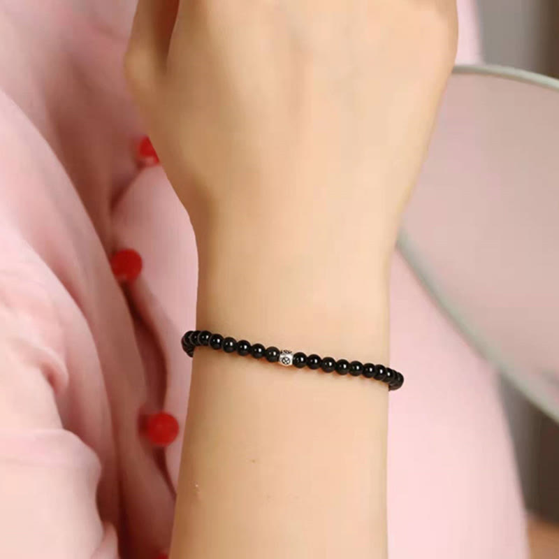 Bransoletka oczyszczająca z Buddha Stones , naturalnego czarnego obsydianu i kwarcu dymnego