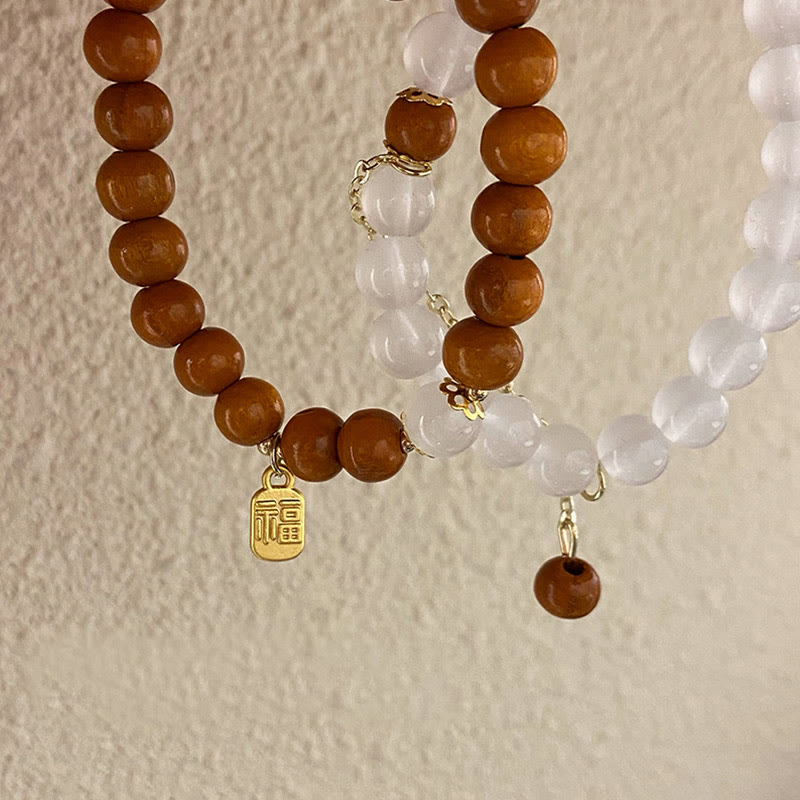 Bransoletka ochronna z Buddha Stones, sandałowym drzewem i kocim okiem Fu Character Charm