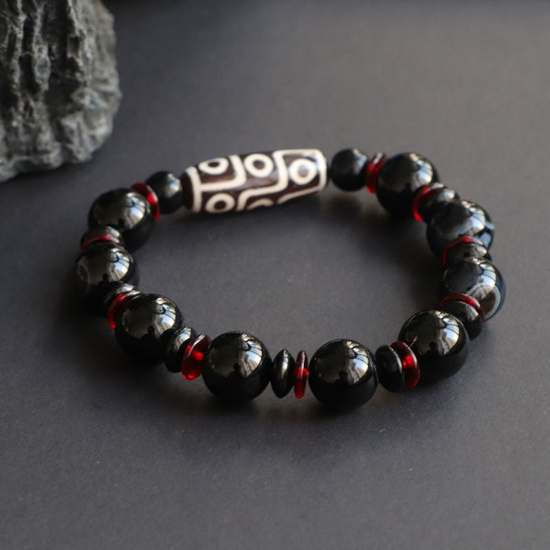 Bransoletka z Buddha Stones z czarnego onyksu i dziewięcioocznych koralików Dzi, chroniąca bogactwo