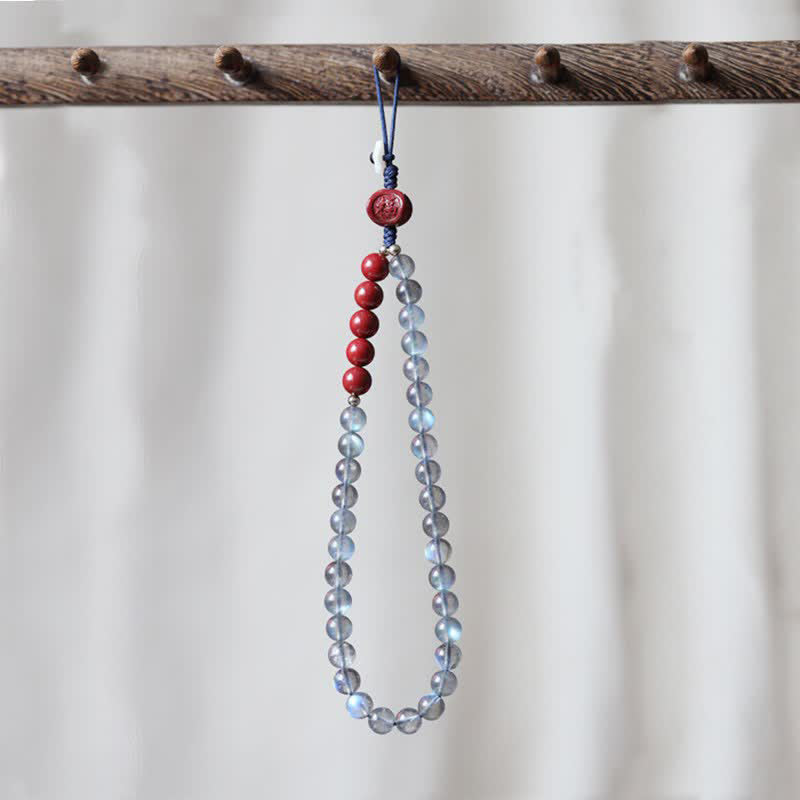 Naturalny kamień księżycowy cynober spokojna pozytywna dekoracja telefonu