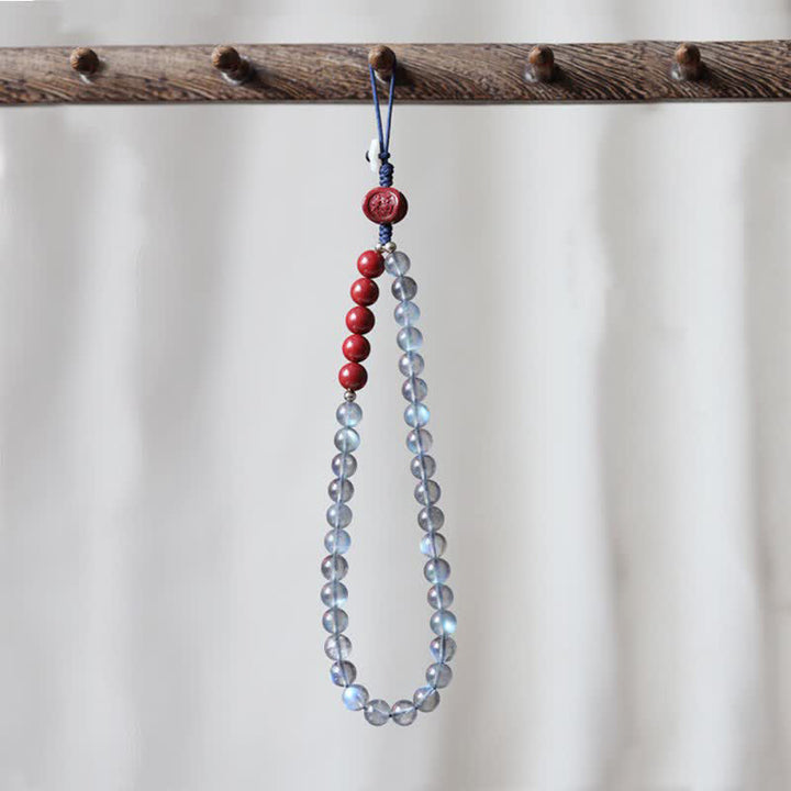 Naturalny kamień księżycowy cynober spokojna pozytywna dekoracja telefonu