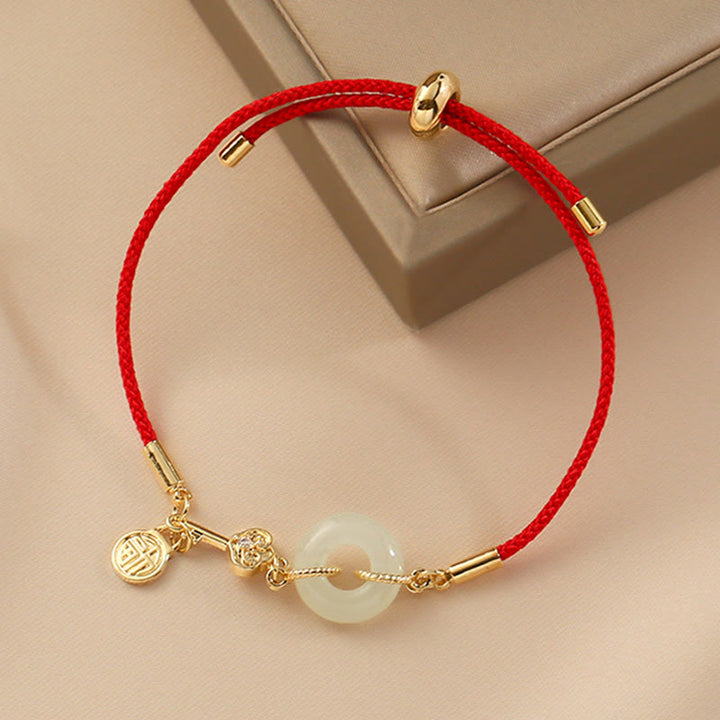 Buddha Stones 18K pozłacane Hetian Jade Peace Buckle Fu Character Luck Red Rope Bracelet