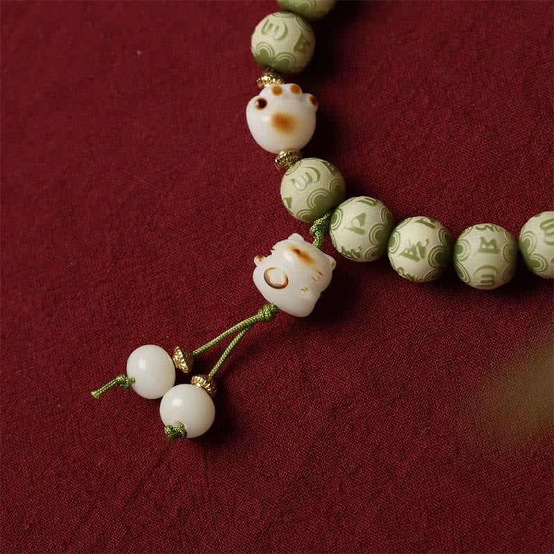 Buddha Stones Zielone Nasiona Bodhi Łapa Kota Om Mani Padme Hum Grawerowana Bransoletka Mądrości - image 5