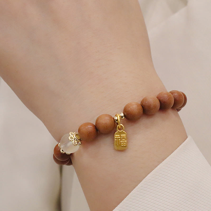 Bransoletka ochronna z Buddha Stones, sandałowym drzewem i kocim okiem Fu Character Charm