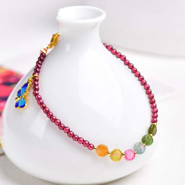 Bransoletka ochronna z turmalinem granatowym i motylem