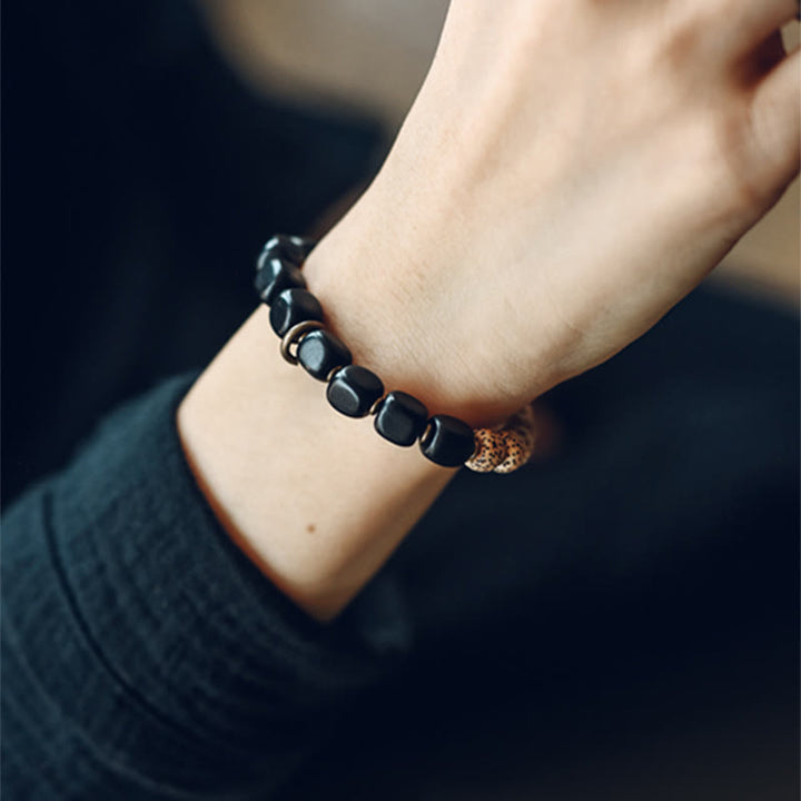 Buddha Stones Tybetańskie Nasiona Bodhi Czarny Obsydian Drewno Hebanowe Miedź Bransoletka Spokoju