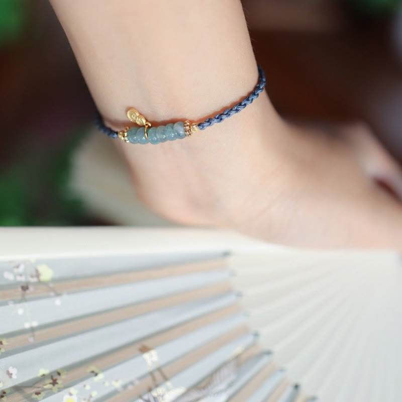 Bransoletka warkoczowa z naturalnego jadeitu i kwarcu rutylowego Fu Character Luck wykonana ze srebra próby 925