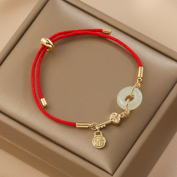 Buddha Stones 18K pozłacane Hetian Jade Peace Buckle Fu Character Luck Red Rope Bracelet