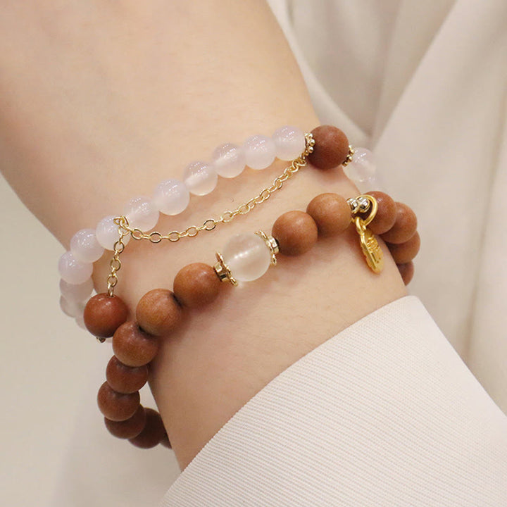 Bransoletka ochronna z Buddha Stones, sandałowym drzewem i kocim okiem Fu Character Charm