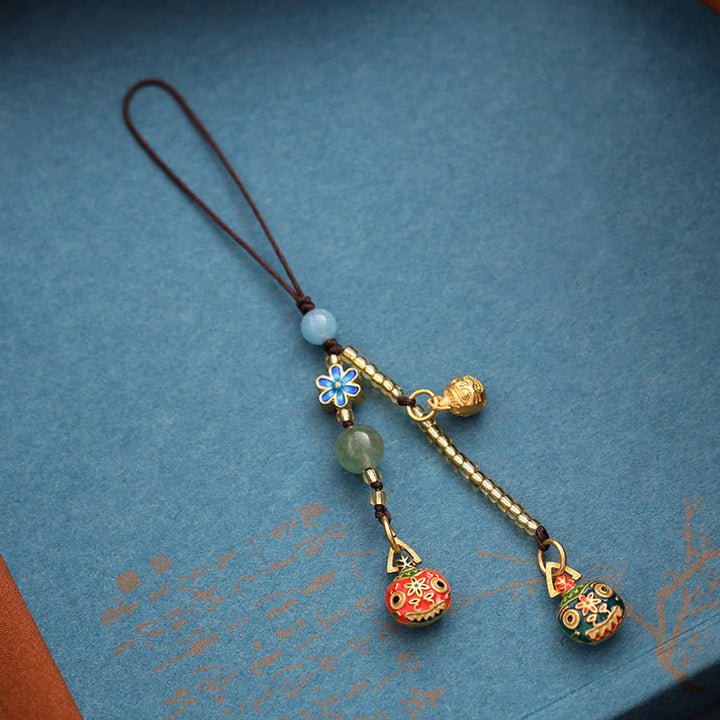 Złoty breloczek do kluczy z motywem rodzinnego szczęścia bestii połykającej złoto