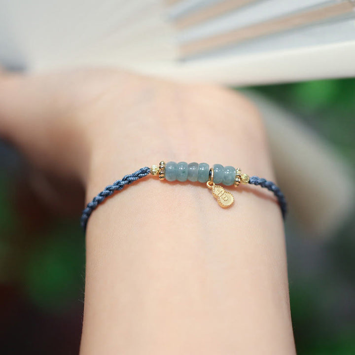 Bransoletka warkoczowa z naturalnego jadeitu i kwarcu rutylowego Fu Character Luck wykonana ze srebra próby 925